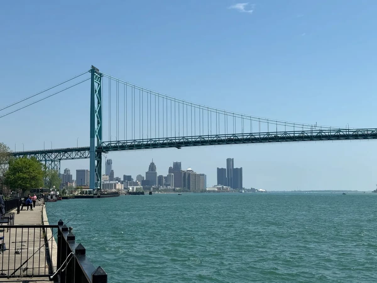 Ambassador Bridge with Detroit skyline across the river in Detroit, Michigan