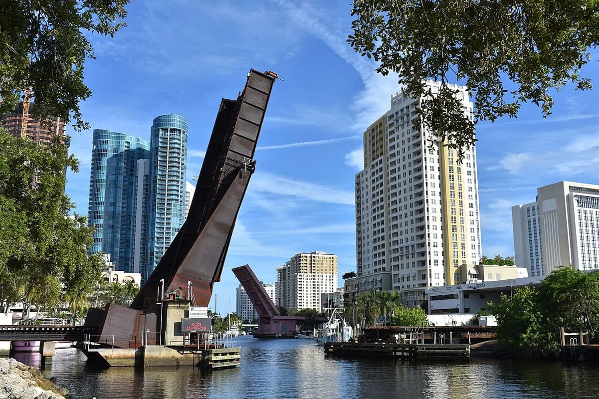 New River with raised bridge and downtown towers in Fort Lauderdale, Florida