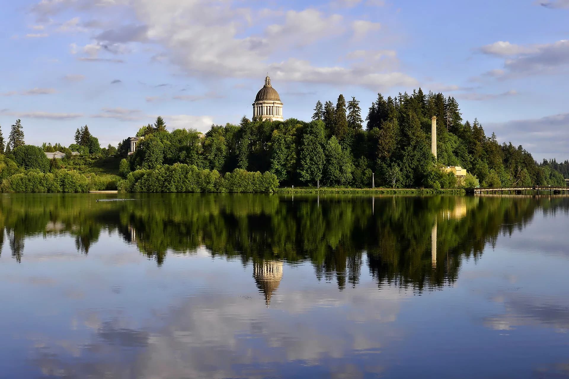 Capitol dome reflected in Capitol Lake, wide in Olympia, Washington